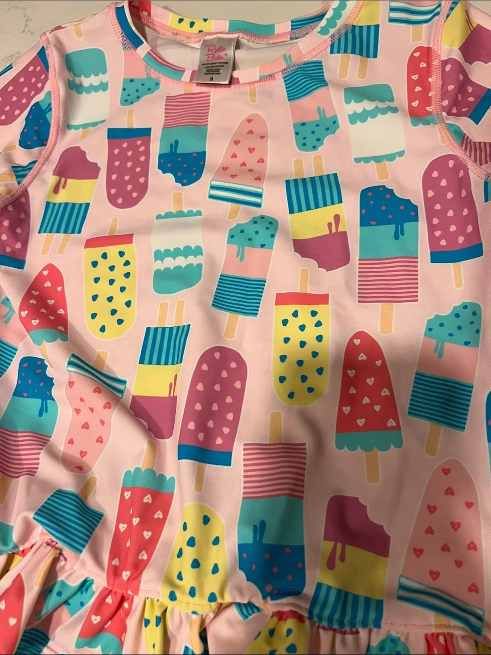 Ruffle Butts Girls Pink Popsicle/Ice Cream Print swim rash guard, size 8